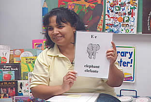 Teacher holding a picture of an elephant