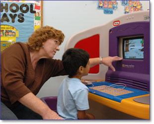 Child playing with computer